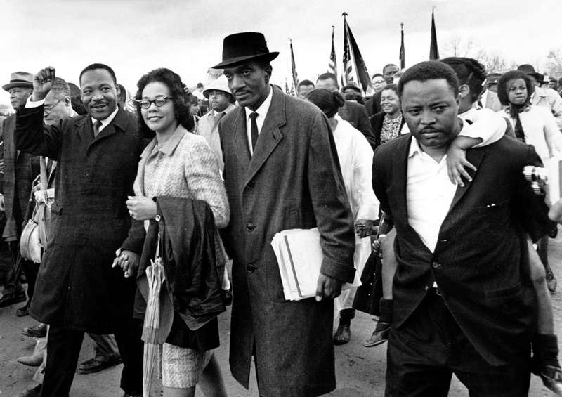 Martin Luther King Jr., and his wife, march in Washington D.C. circa 1960s.